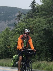 Jack Linger riding bike through mountains