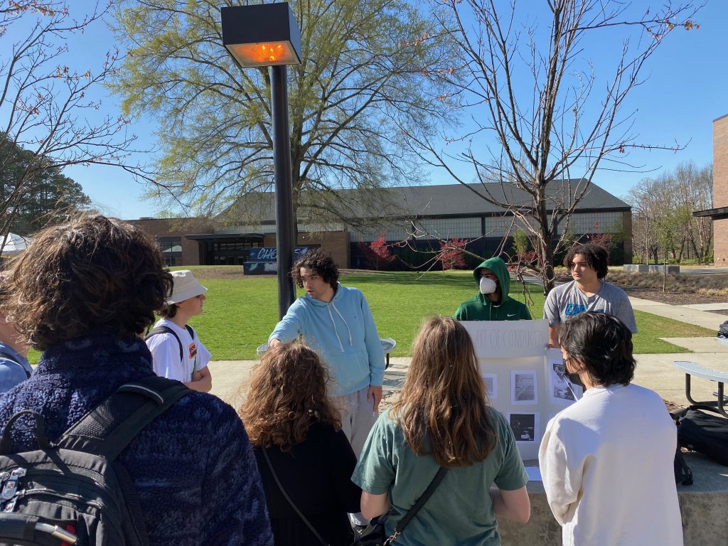 Student speaking to group